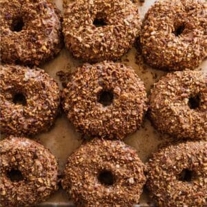 Doughnuts lined neatly on a baking sheet at Knead Doughnuts in Westerly