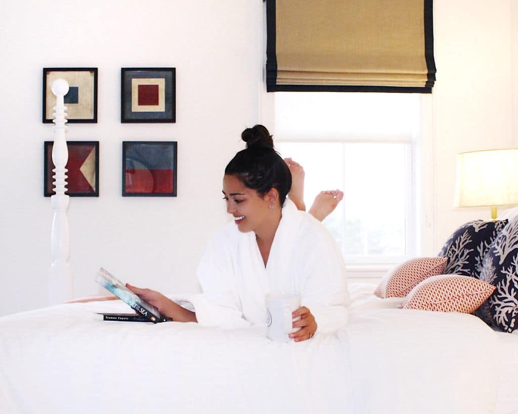 Guest Room, Woman in Bed w/Robe. Mystic, CT, Downtown Mystic. Whaler's Inn